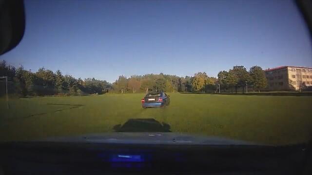 Car chase on football pitch